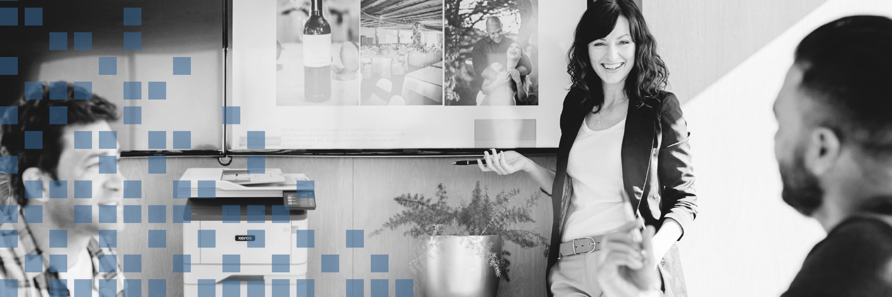 Workgroup looking at screens with a printer nearby