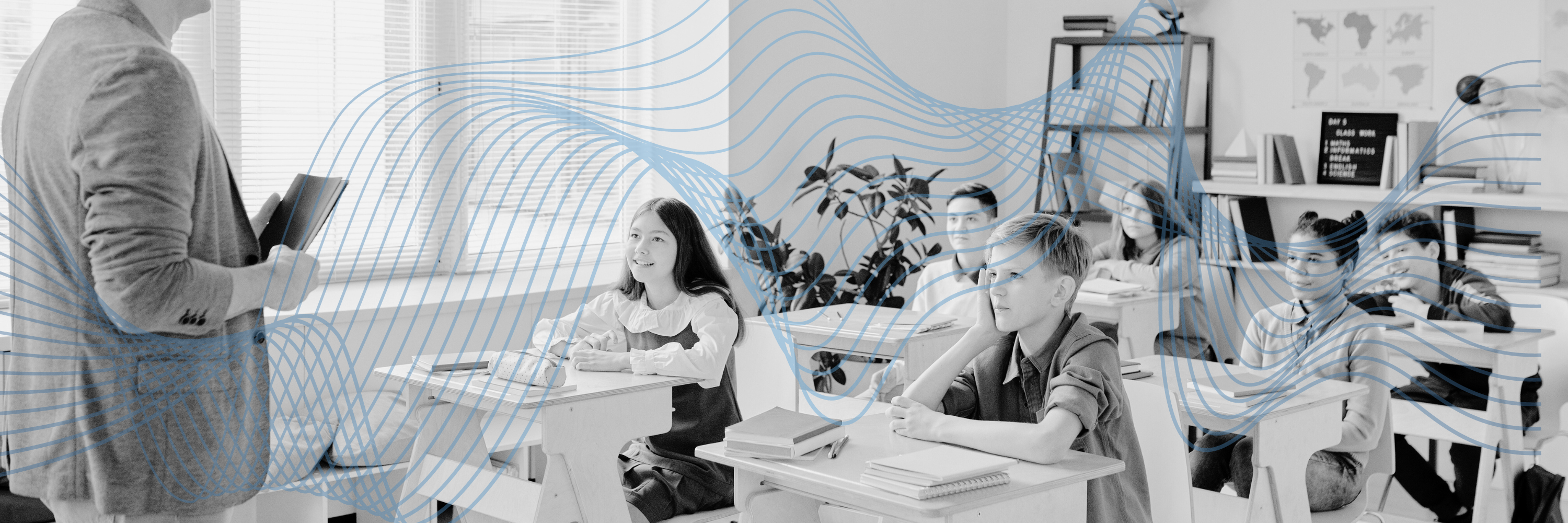 Teacher instructs student in the classroom.