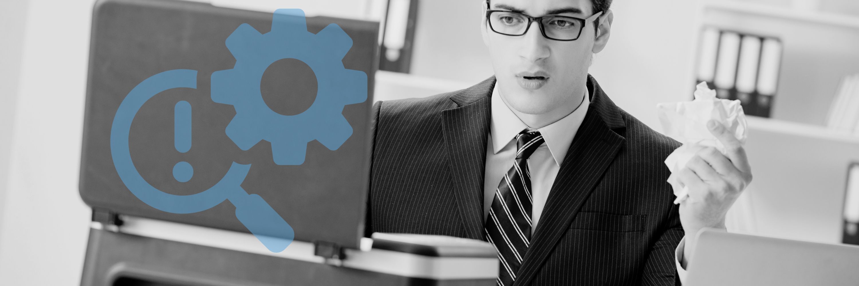 A man looking puzzled at a printer paper jam