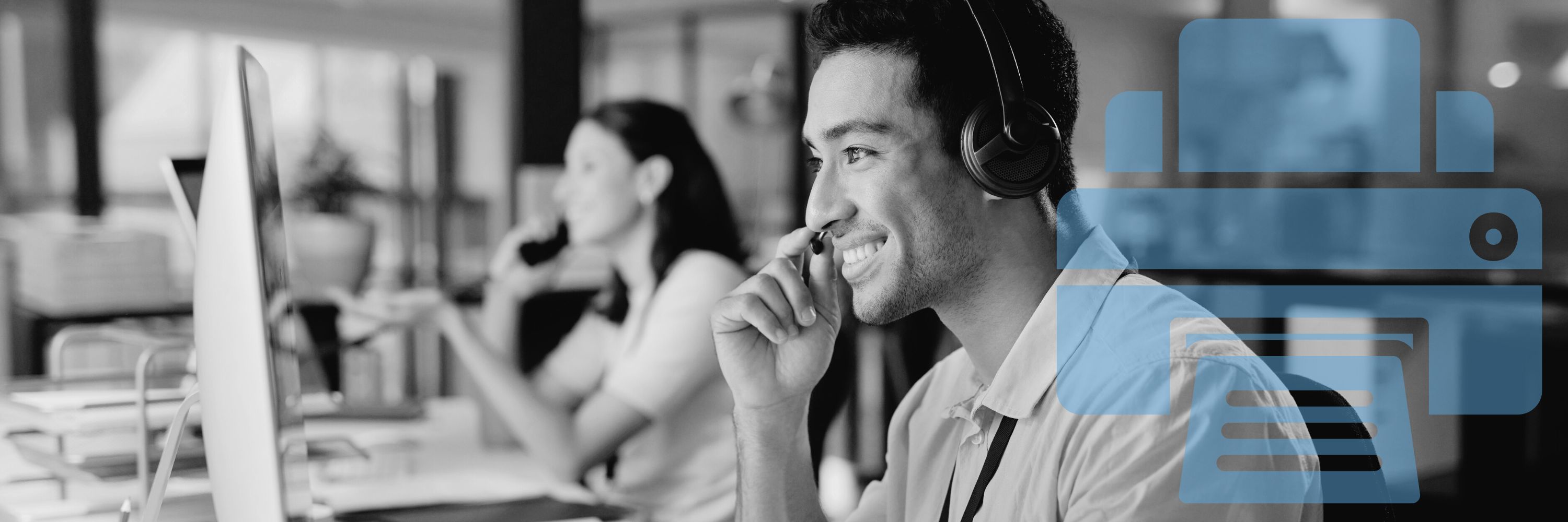 A man doing remote customer support in front of a computer