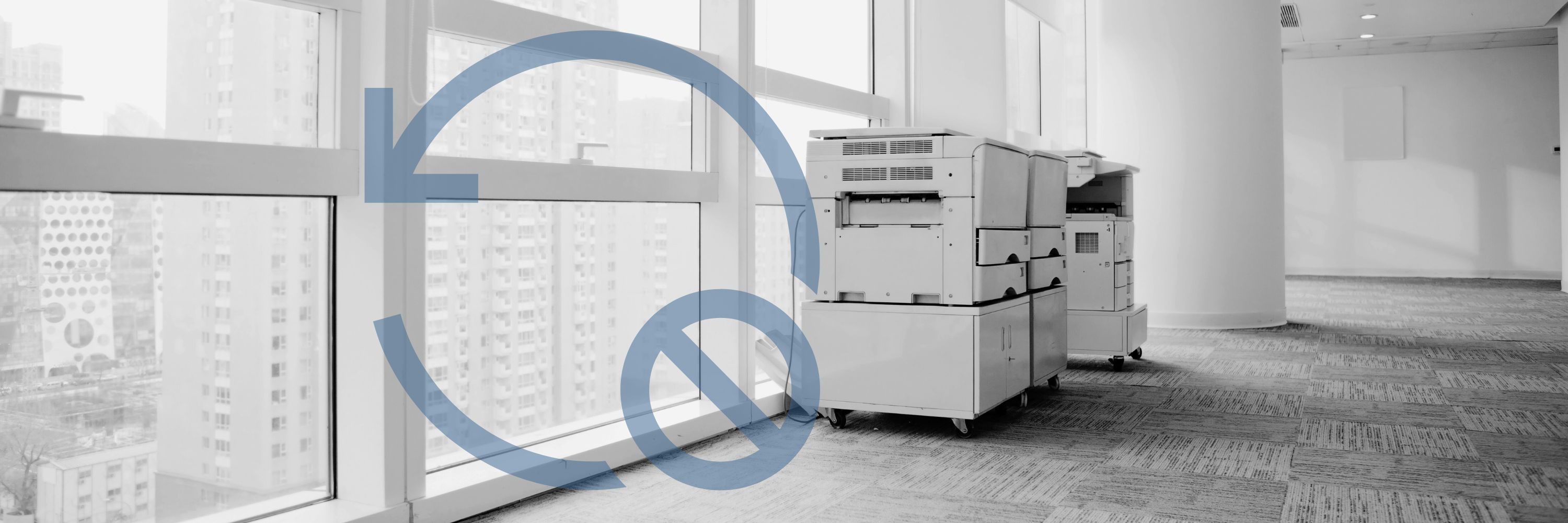 A printer in a large empty hallway