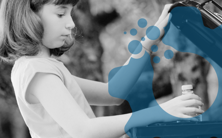 A girl recycles for the good of the environment.