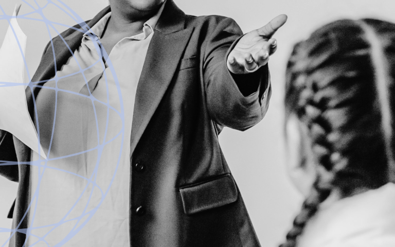 Teacher instructs students in the classroom.