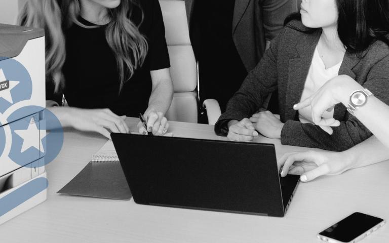 Women working near a Xerox printer