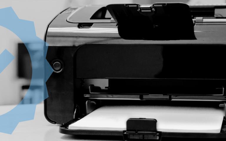 A home printer with graphic overlay of a checkmark