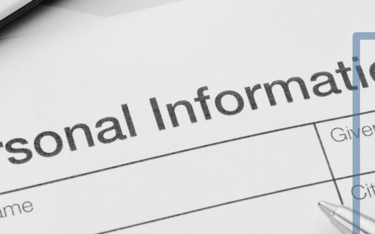 A paper with personal information fields and a graphic overlayed on top of crossed out lines