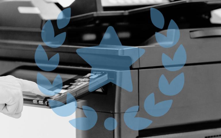 A person uses a high quality printer and a graphic of quality is overlayed on top