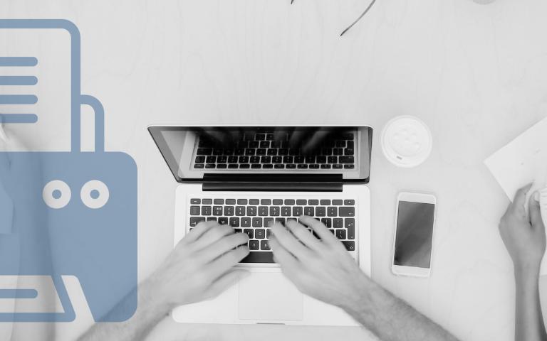 Students studying on table with laptops and paperwork