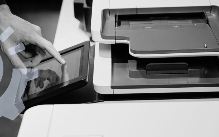 A man using a printer's screen interface