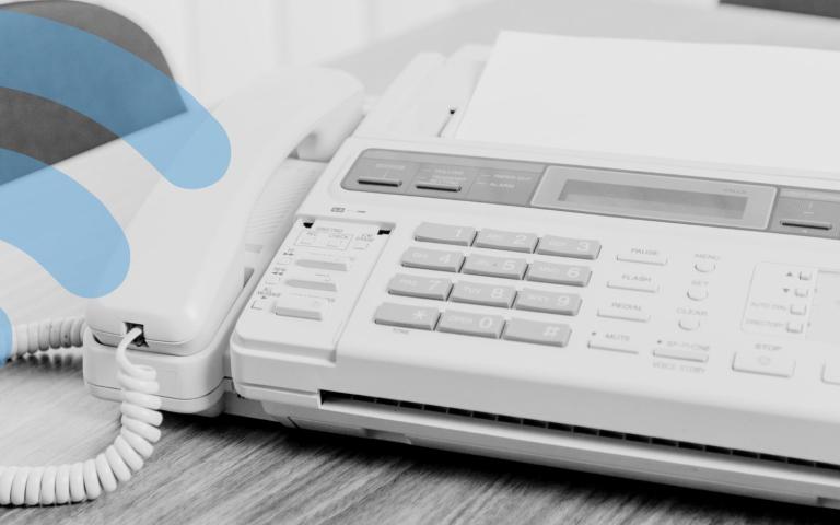 A fax machine sitting on an office table