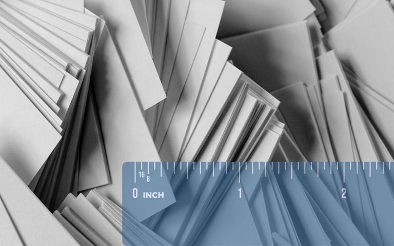 Hundreds of papers stacked in different directions