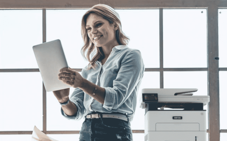 A person on a tablet next to the Xerox B225