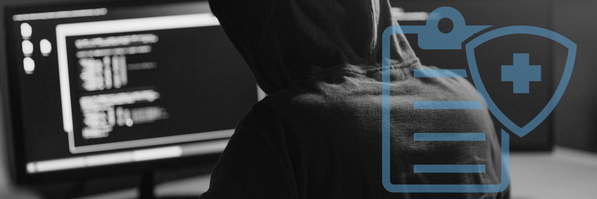 A hacker on a desktop computer with a graphic overlay of a clipboard with a health guard icon