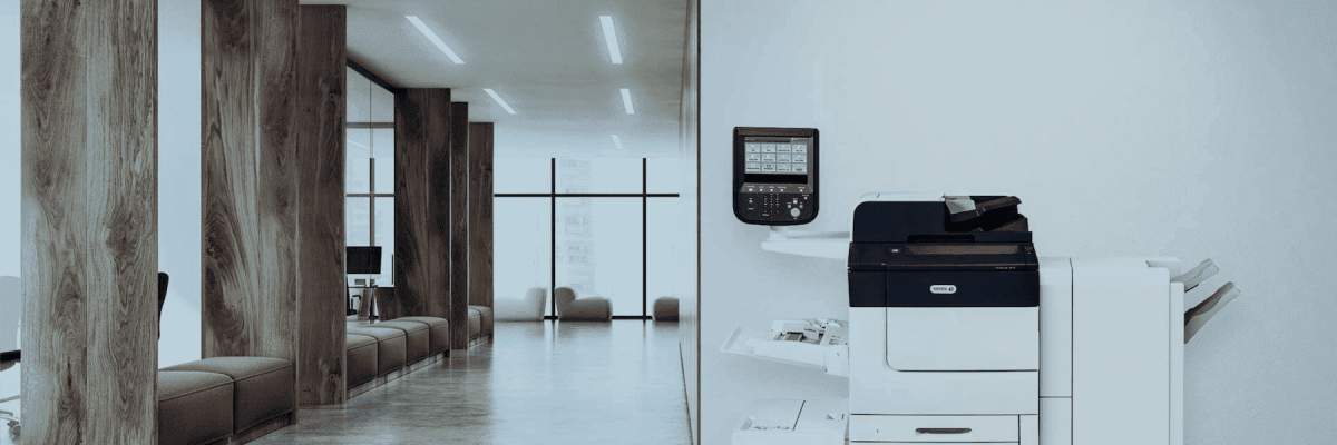 Xerox PrimeLink C9065 next to a wall in an empty hallway