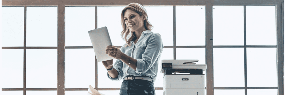 A person on a tablet next to the Xerox B225