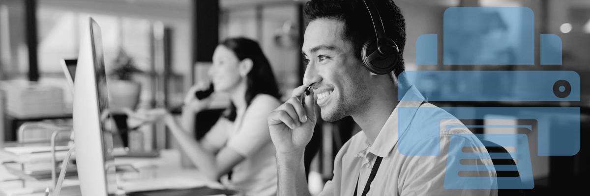 A man doing remote customer support in front of a computer