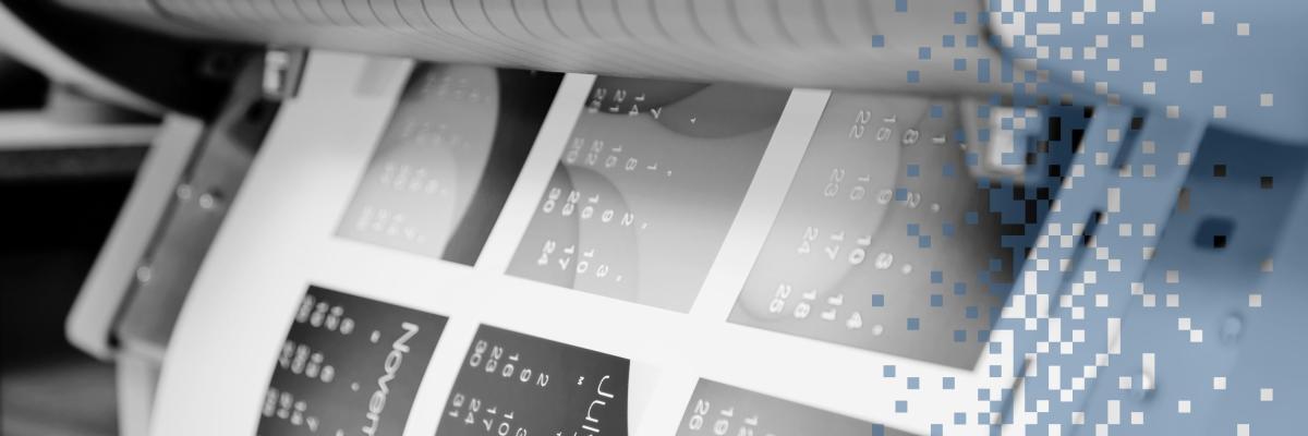 A closeup of a document coming out of a printer