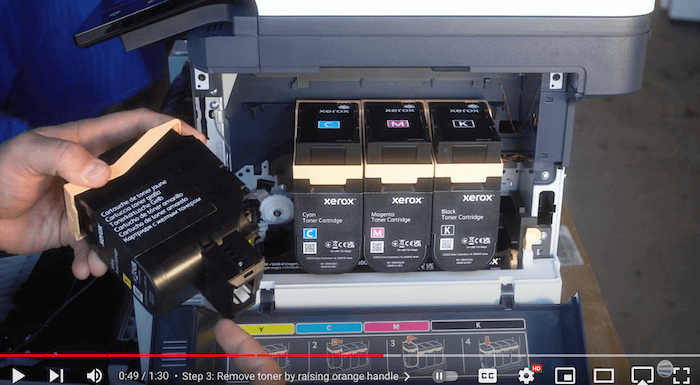 Printer technician notes insert at bottom of toner cartridge on the Xerox C410/C415 to replace the toner