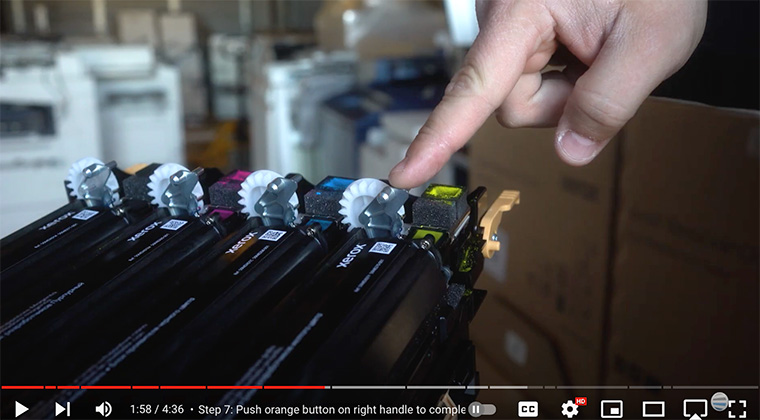 Printer technician removes color developer units from old imaging unit for the Xerox VersaLink C410/C415