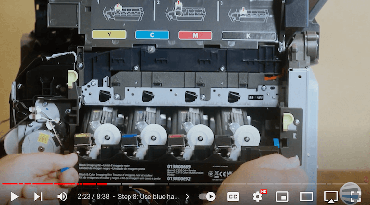 Printer technician pulls imaging kit out of the Xerox C315 printer