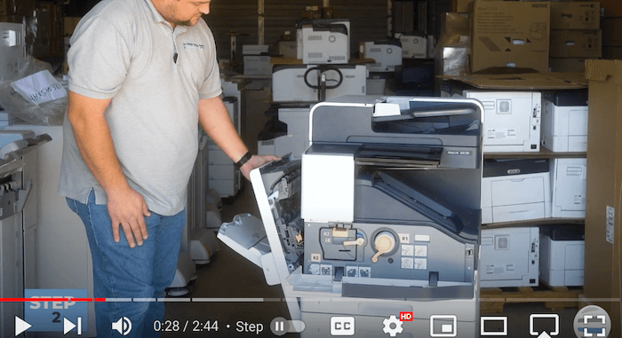 Printer technician opens the left side cover on the Xerox AltaLink B8090 Printer to replace print cartridge