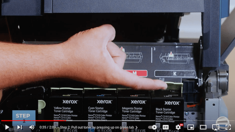 A printer technician pulls out the toner on the Xerox C315 Color Multifunction Printer