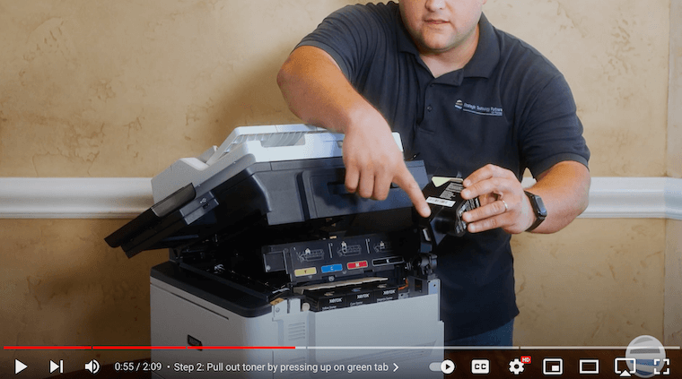 A printer technician inserts new toner on the Xerox C315 Color Multifunction Printer