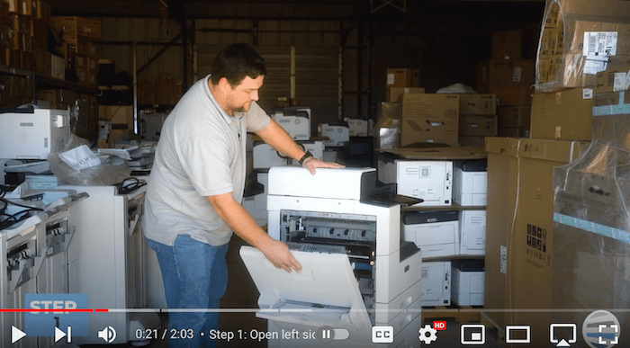 Printer technician opens the left side cover on the Xerox AltaLink B8090