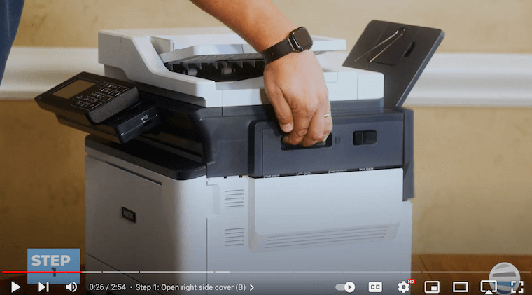A printer technician opens the right side cover on the Xerox C315
