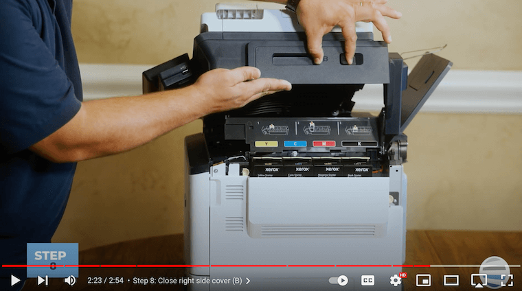 A printer technician closes right side cover on the Xerox C315