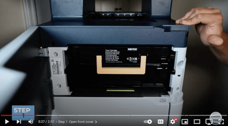 A printer technician opens the front cover of VersaLink B625 to access the bypass tray roller kit