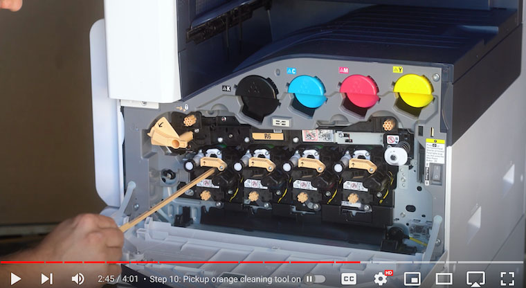 Printer technician uses cleaning tool to clean LED array on the Xerox VersaLink C7020/C7025/C7030