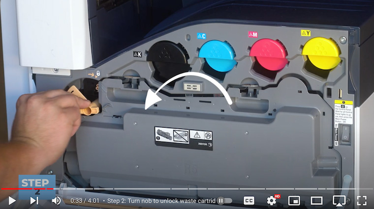 Printer technician unlocks waste cartridge on the Xerox VersaLink C7020/C7025/C7030 Printer