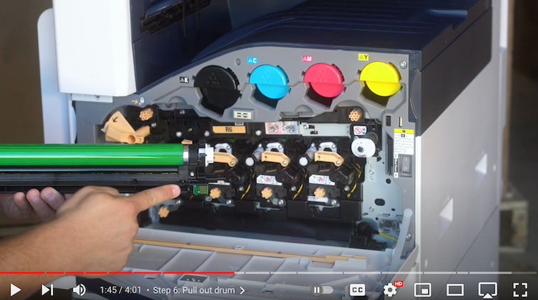 Printer technician gets ready to insert new drum on Xerox VersaLink C7020/C7025/C7030