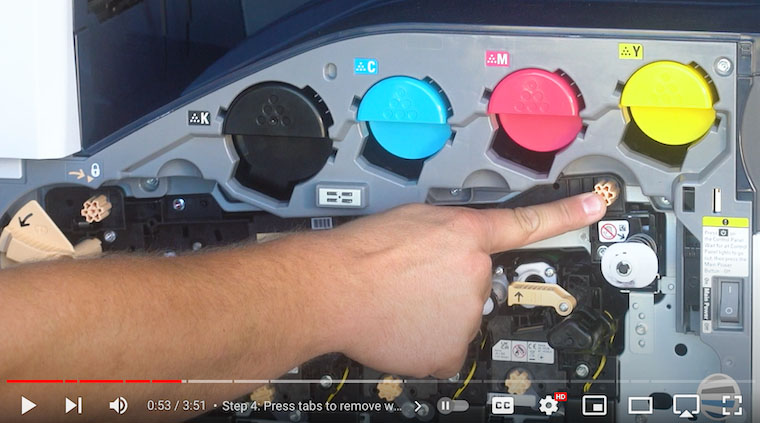 Printer technician removes finger screws on Xerox VersaLink C7020/C7025/C7030