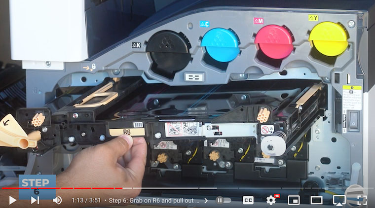 Printer technician pulls out transfer belt assembly on Xerox VersaLink C7020/C7025/C7030