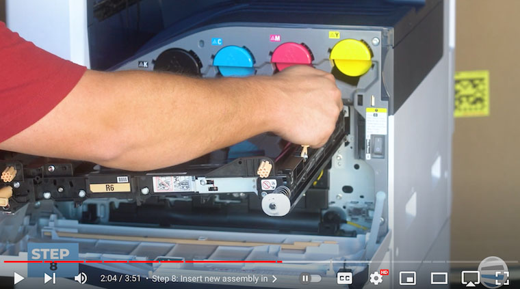 Printer technician inserts new assembly on Xerox VersaLink C7020/C7025/C7030